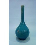 A Linthorpe style vase on a blue ground. 20.5cm height