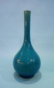 A Linthorpe style vase on a blue ground. 20.5cm height