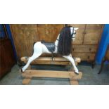 A dapple grey rocking horse