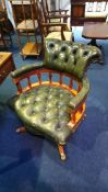 A green leather Chesterfield style office swivel chair