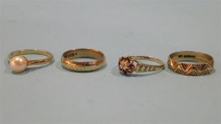 Three 9ct dress rings and one other, total weight 8.7grams