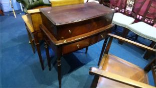 A reproduction mahogany writing desk with fold over top, below two short drawers, 75cm wide