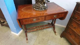 A reproduction mahogany sofa table, with inset leather top