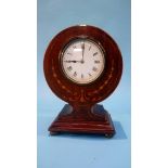 An Edwardian mahogany mantel clock of spherical design. 23cm height