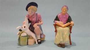 A Royal Doulton figure 'The Family Album', HN 2321 and 'The Homecoming', HN 3295 (2)