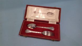 A cased silver reproduction spoon and fork