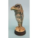 A Martin Brothers of London grotesque jar and cover of a bird on a mottled green ground, supported
