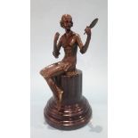 A reproduction bronze model of a lady holding a fan