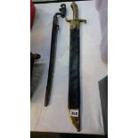 A socket bayonet and a brass handled sword