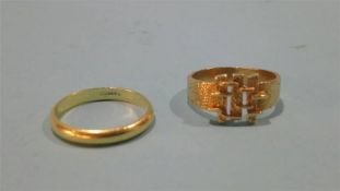 A 9ct gold ring and another yellow metal ring
