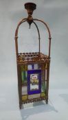 An Edwardian brass hanging ceiling light, with four leaded glass panels. 66cm height