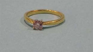 An 18ct gold solitaire diamond ring