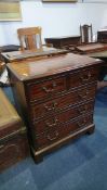 A small reproduction mahogany chest of drawers. 62cm wide