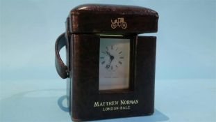 A miniature traveling carriage clock in fitted case, the dial signed Matthew Norman