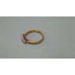 A 9ct gold three stone diamond ring