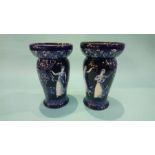 A pair of Royal Doulton 'Morrisian' vases on a blue ground, decorated with girls dancing, numbered