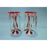 A pair of Victorian lustres on a red and white flashed ground, each with 6 clear drops. 29cm height