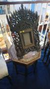 A Far Eastern carved decorative frame and an octagonal occasional table