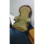 A Victorian mahogany spoon back armchair