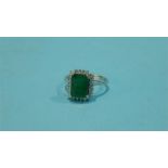 An 18ct white gold diamond and emerald ring, stamped 750