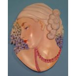 A Beswick Art Deco wall mask of a lady, printed mark, number 8137 and impressed number 436. 31cm