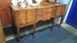 A reproduction mahogany sideboard