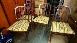 Four reproduction mahogany chairs
