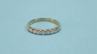 A 9ct gold diamond half hoop eternity ring