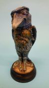 A Martin Brothers of London grotesque jar and cover of a winking bird, on a mottled blue ground,