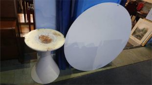An Arkana design circular white top table, 121cm diameter