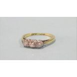 An 18ct gold three stone diamond ring