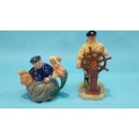 A Royal Doulton 'Old Salt' teapot, D6818 and a Royal Doulton figure 'The Helmsman', HN 2499 (2)