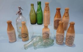Seven Stockton on Tees stoneware bottles, a Newcastle bottle, a Stockton syphon, three Stockton