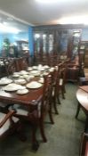 A large mahogany dining room suite comprising; display cabinet, extending table with two leaves