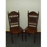 Pair of Victorian oak hall chairs, turned finials,