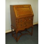 Golden oak writing bureau with geometric pattern,