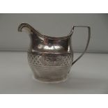 George III silver cream jug, helmet form, reeded e