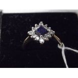 18ct gold diamond and blue stone ring