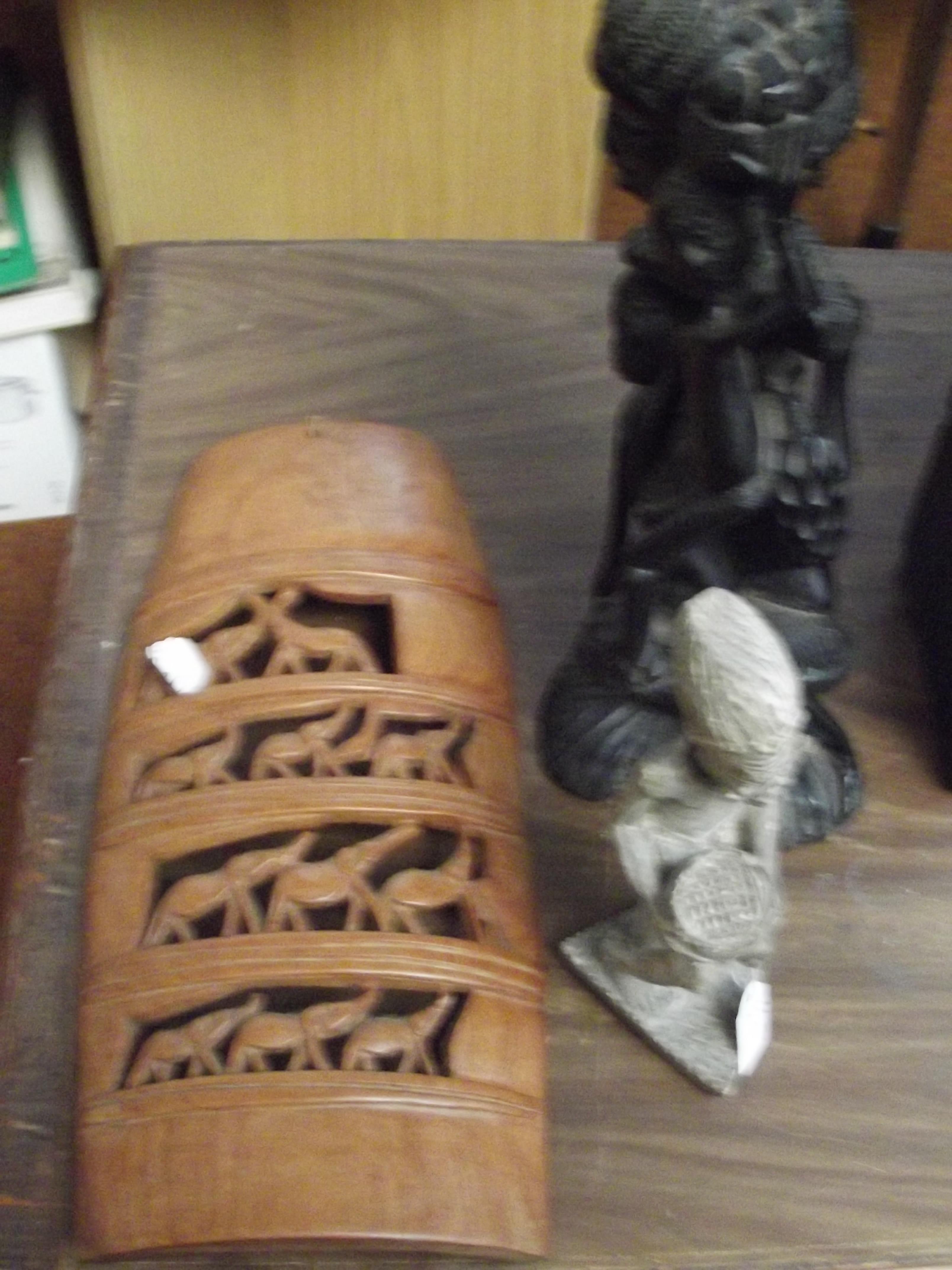 Two carved wood figures and one other