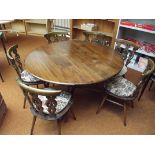 Ercol table with six carved chairs,