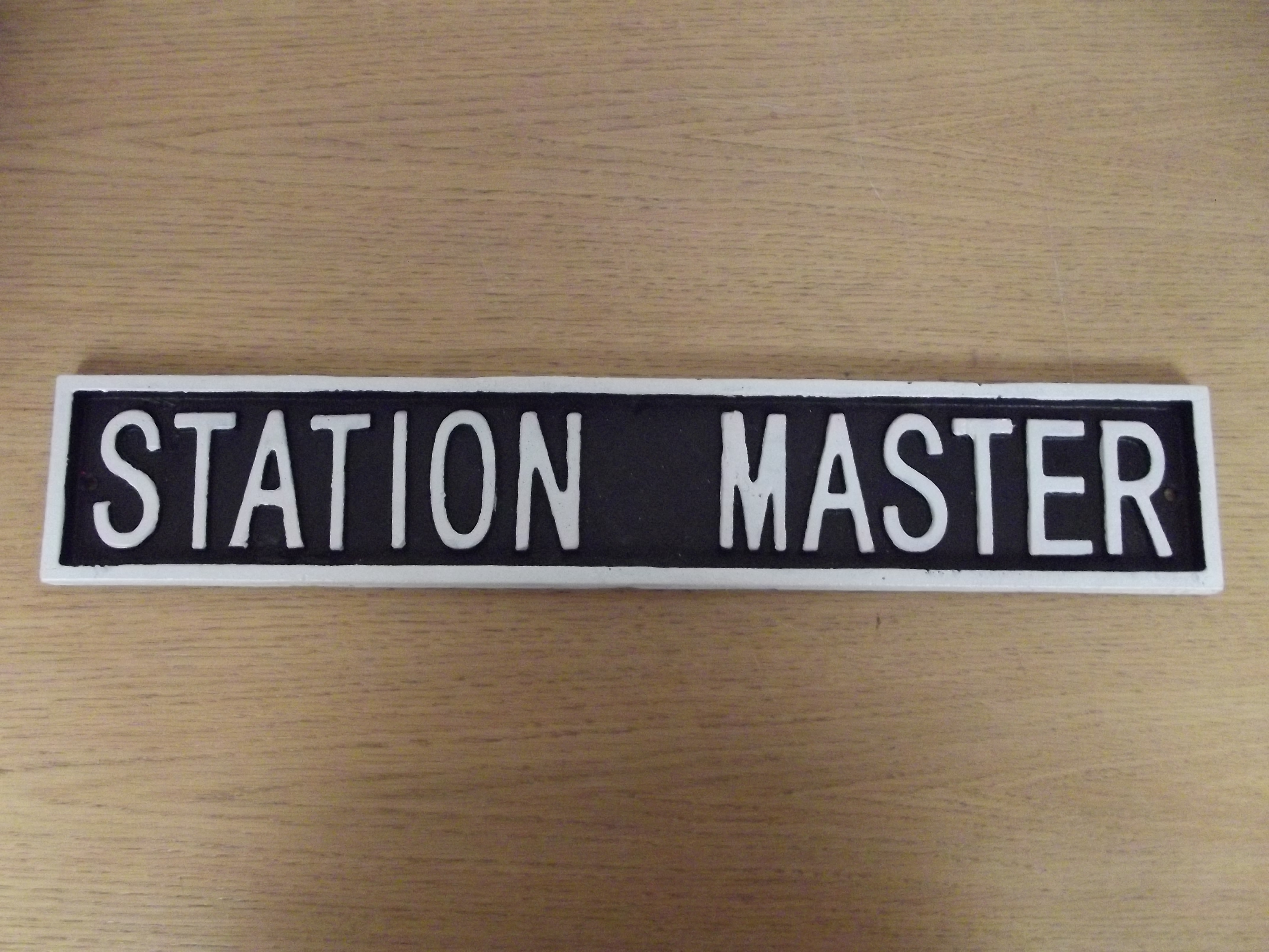 Cast iron, Station Master, sign