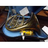 Cased brass French horn