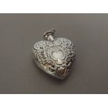 Silver stamped perfume bottle, heart