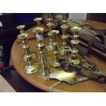 Collection of brass candlesticks, some Victorian e