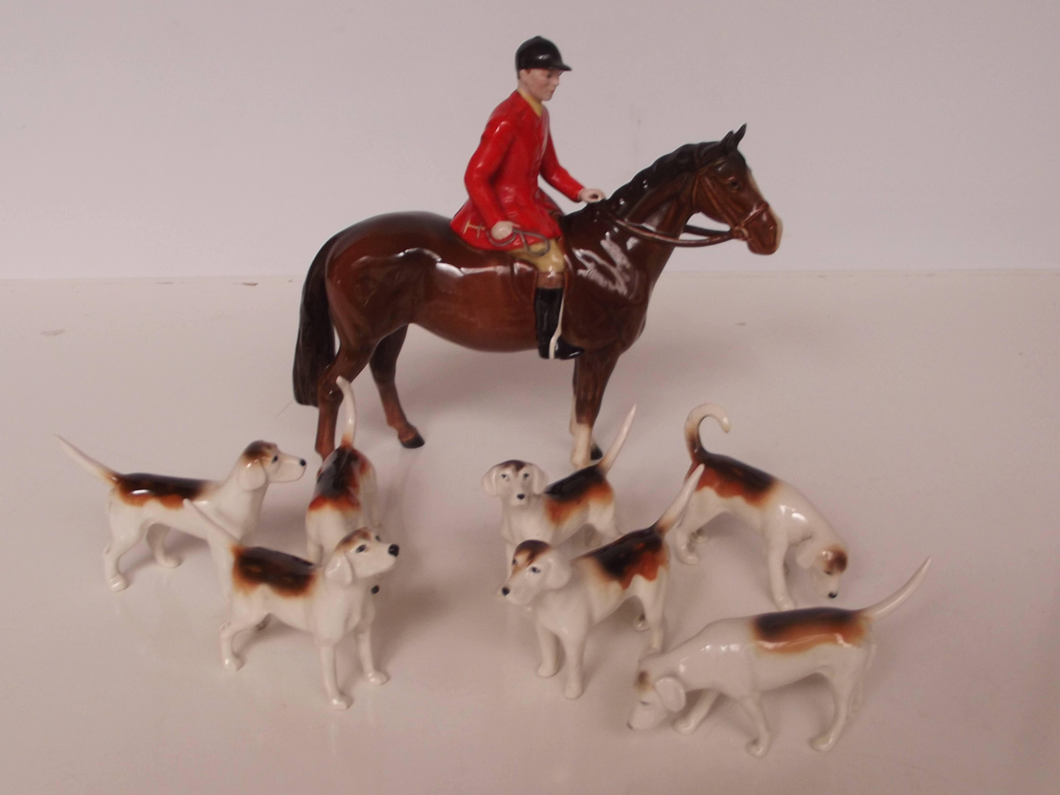 Beswick huntsman and seven hounds