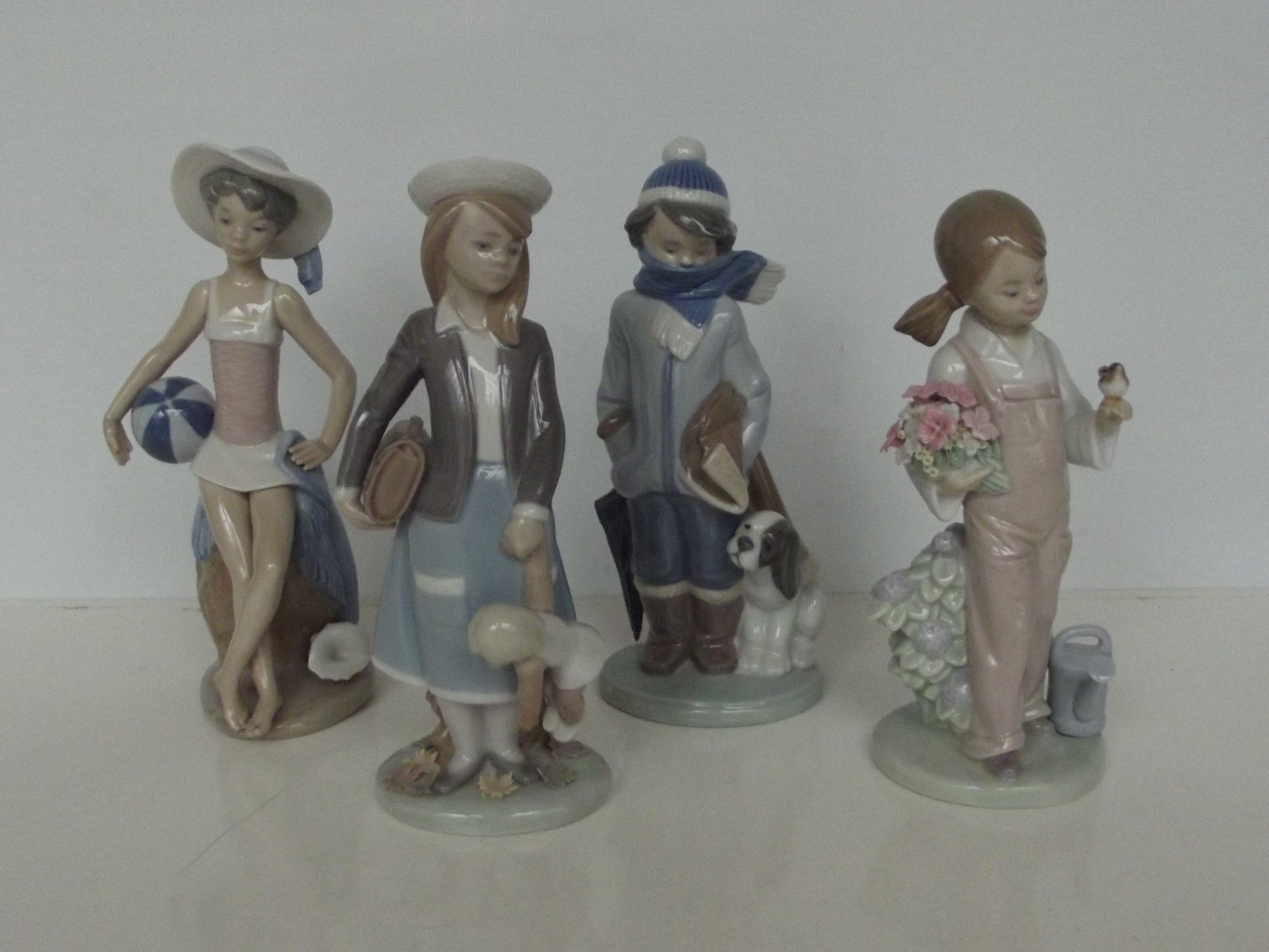 Set of four Lladro figures depicting the four seas