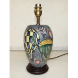 Moorcroft table lamp tube lined depicting various