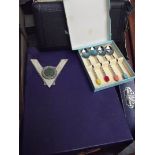 Mixed box of flatware to include a car badge