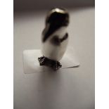 Silver stamped figure, penguin