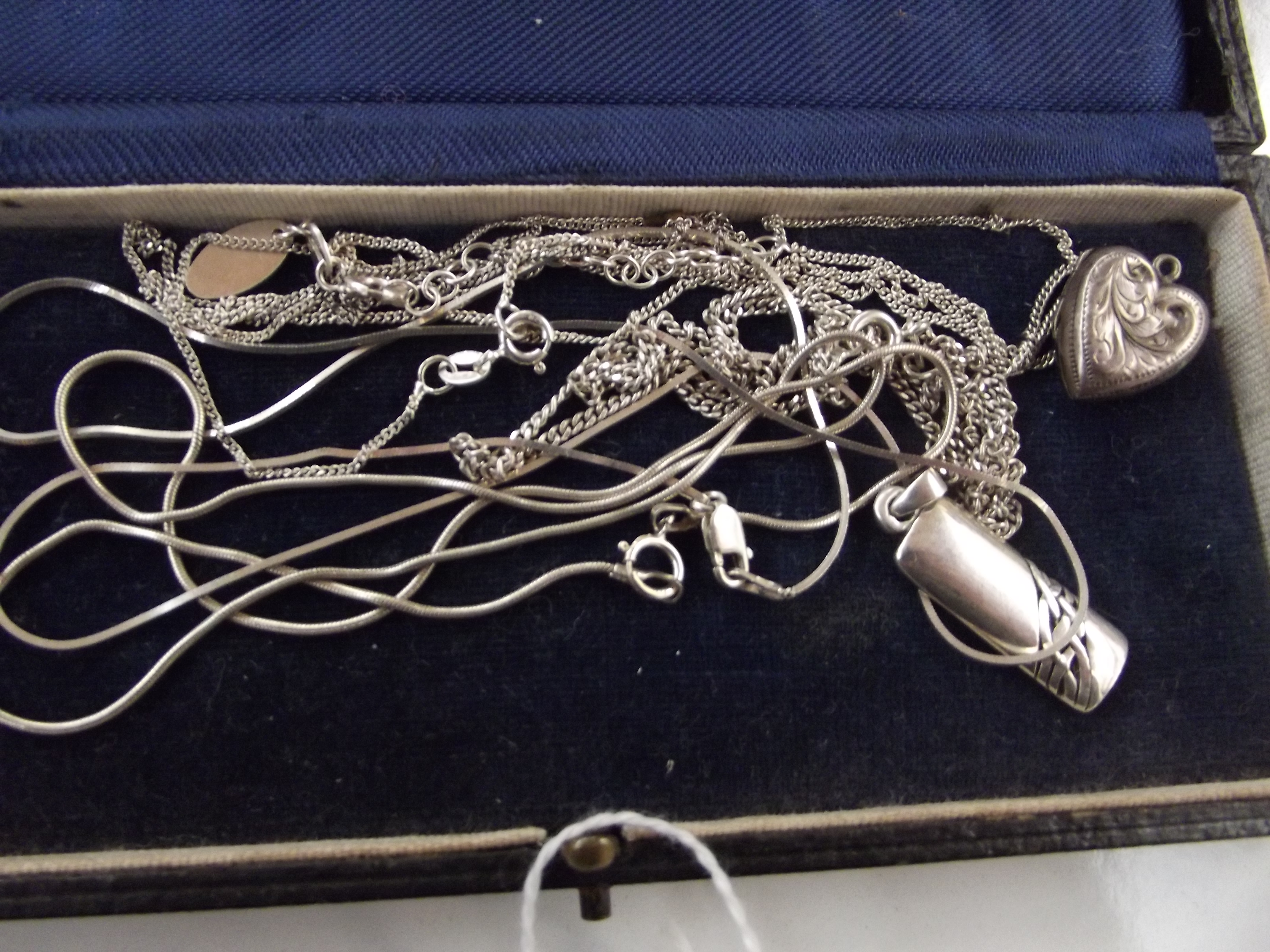 Collection of silver chains and others